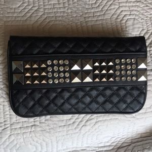 Studded black quilted clutch
